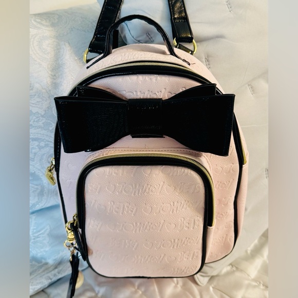 Betsey Johnson Handbags - Betsey Johnson Light Pink Backpack with Black Bow Charm